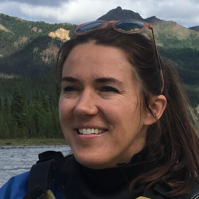 leah nenaber LK10 listed facilitator smiling with mountains in the background